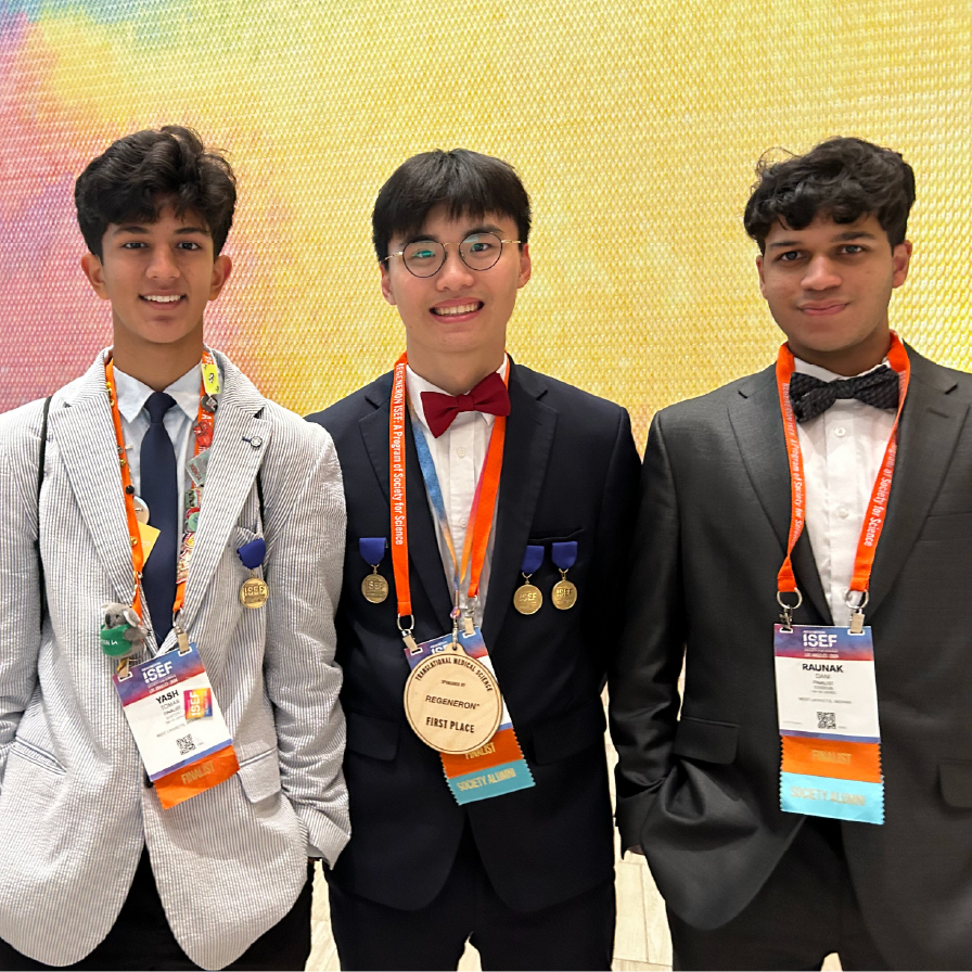 High school students wearing medals at the sciences fair